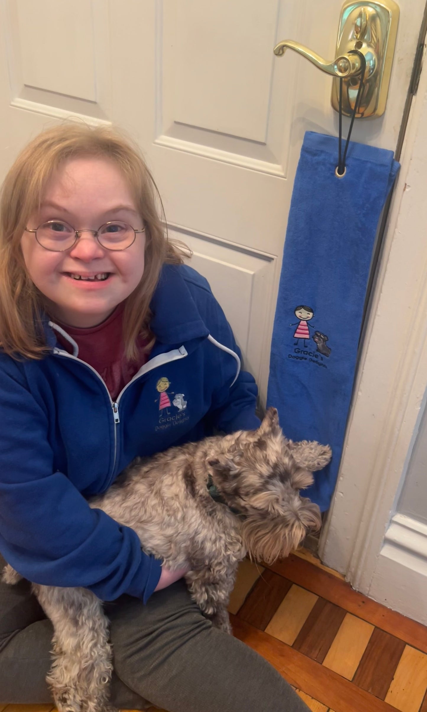 Gracie and G-Dog Merle show off the new custom paw towel